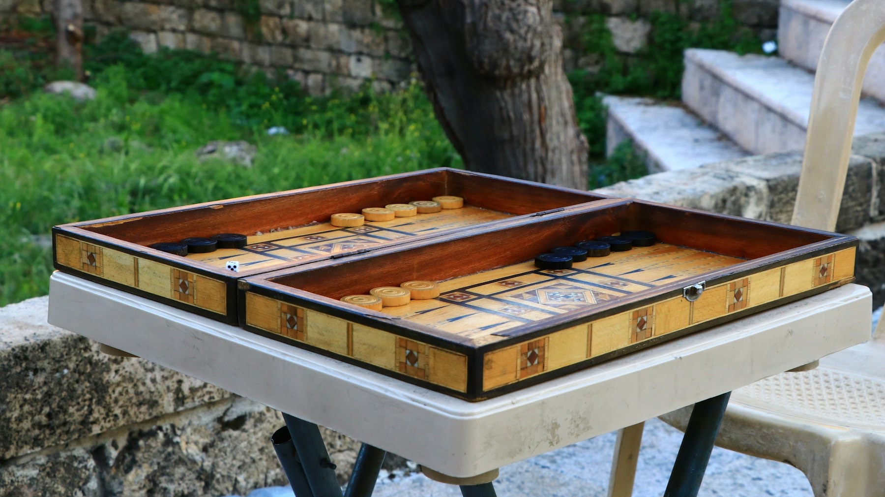 A backgammon board set out for a match
